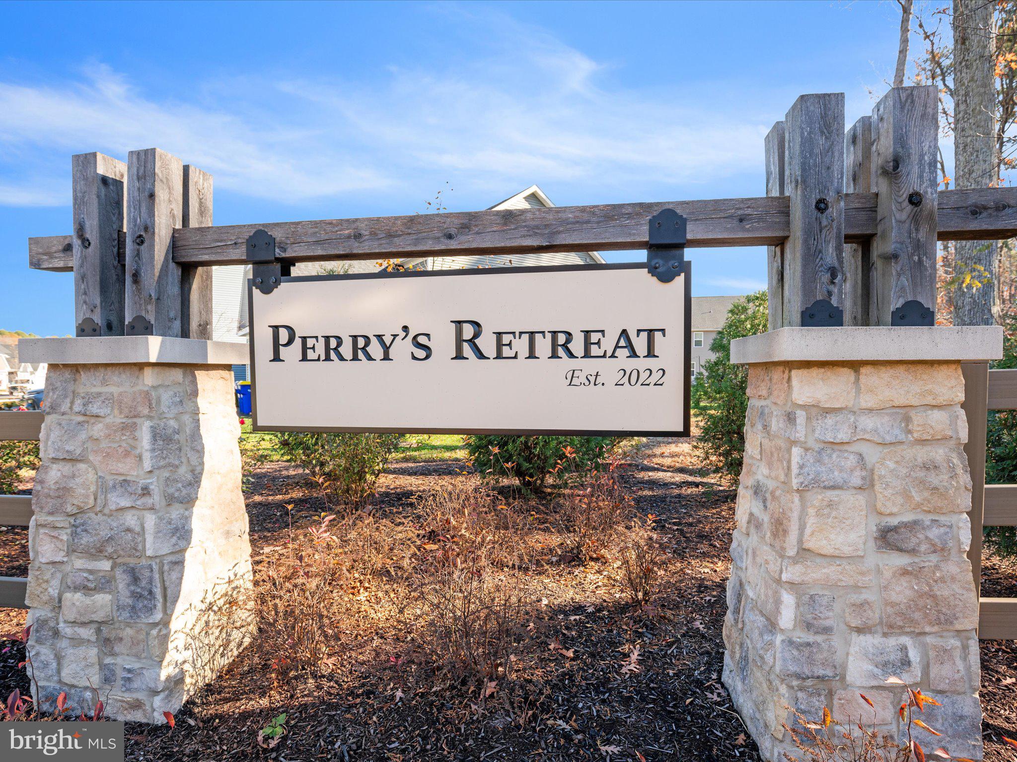 303 Pathfinder Circle Grasonville, MD 21638 - Photo 2 of 38 a sign broad in front of building