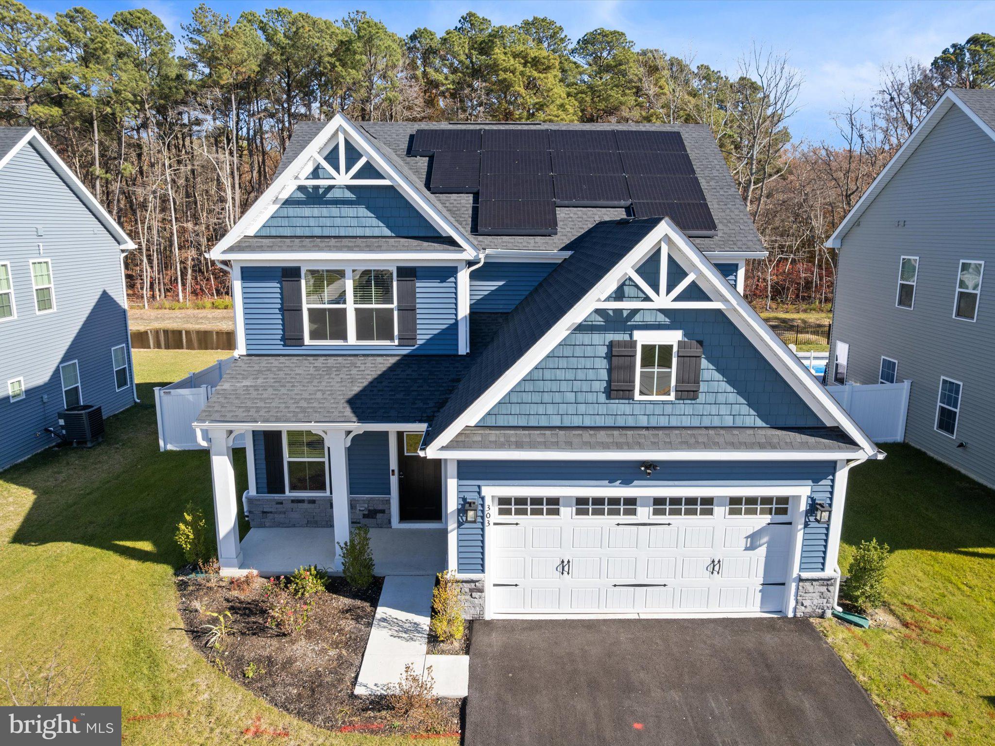 303 Pathfinder Circle Grasonville, MD 21638 - Photo 3 of 38 a front view of a house with a yard
