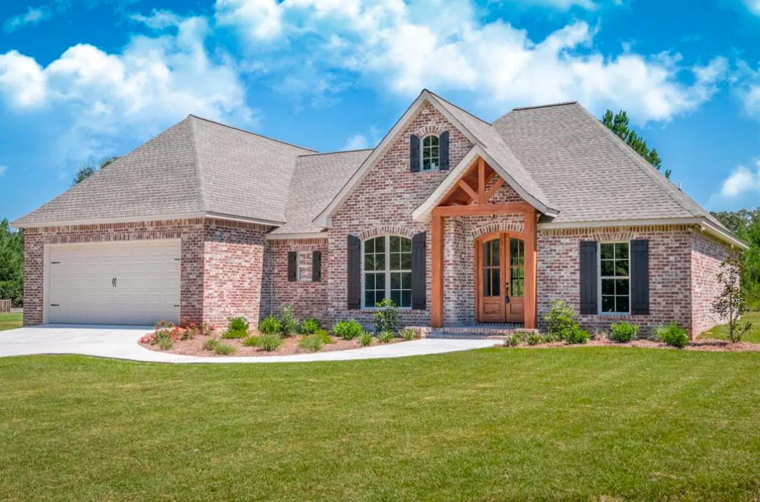 42 Sawgrass Trinity, TX 75862 - Photo 1 of 42 a front view of a house with a yard and garage