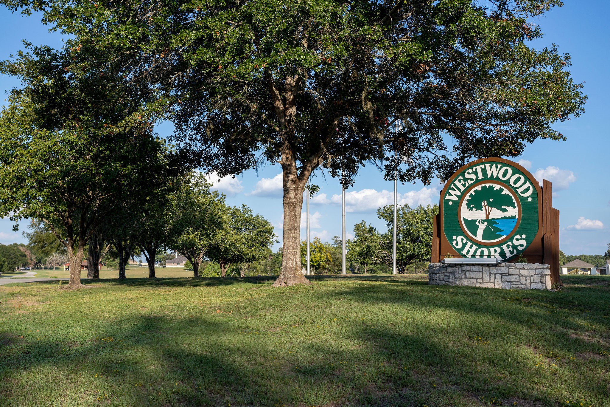 42 Sawgrass Trinity, TX 75862 - Photo 35 of 42 a sign board with a play ground in the back yard