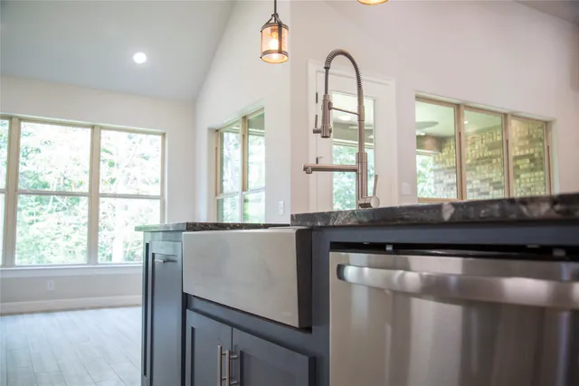 a view of a kitchen with a large window