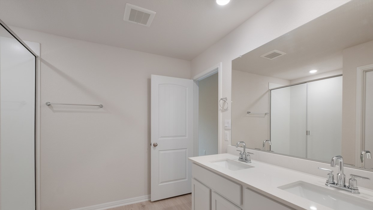329 Lone Cedar Road Marble Falls, TX 78654 - Photo 16 of 19 a bathroom with a double vanity sink and a mirror
