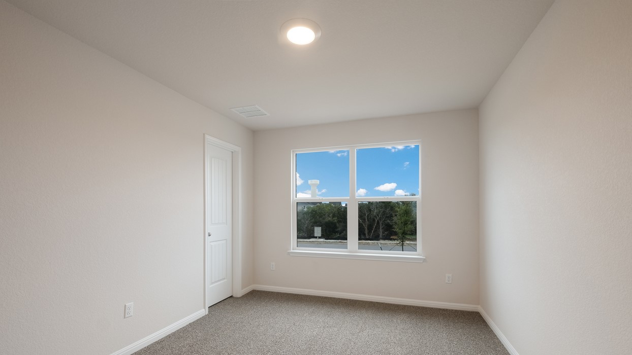 329 Lone Cedar Road Marble Falls, TX 78654 - Photo 17 of 19 a view of an empty room with a window