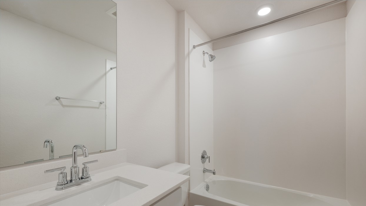 329 Lone Cedar Road Marble Falls, TX 78654 - Photo 19 of 19 a bathroom with a bathtub a sink and a mirror