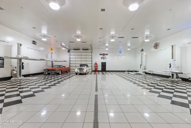a view of a kitchen with a sink and a refrigerator