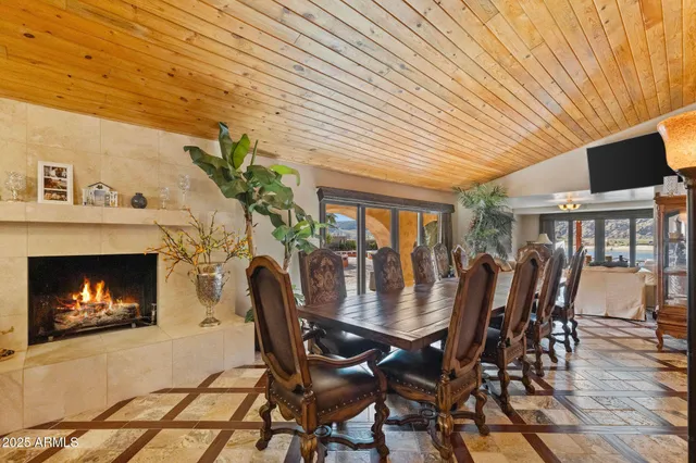 a bed room with a bed television and a large window