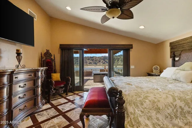 a bathroom with a tub a sink and a large mirror