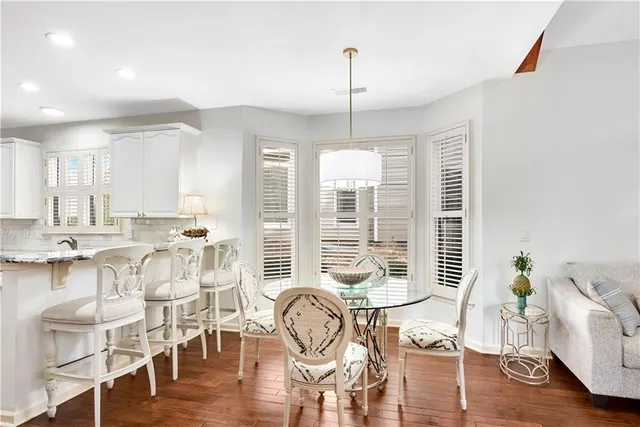 a bathroom with a sink a mirror and a window