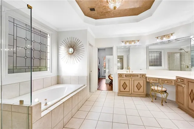 a bathroom with a tub shower and sink