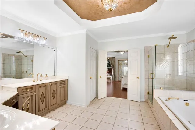 a bathroom with a sink vanity mirror and toilet