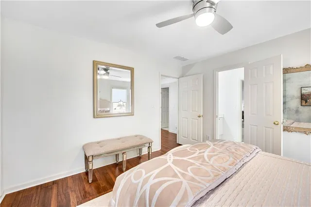 a bathroom with a sink and mirror with toilet
