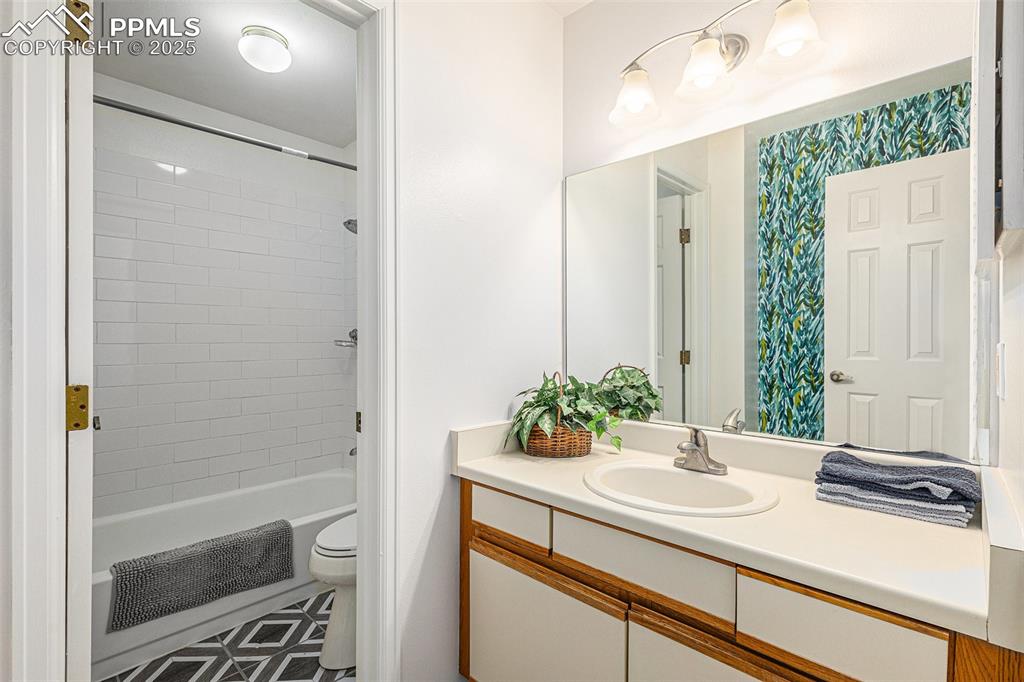 846 Tenderfoot Hill Road, Unit 202 Colorado Springs, CO 80906 - Photo 11 of 19 a bathroom with a sink and a mirror