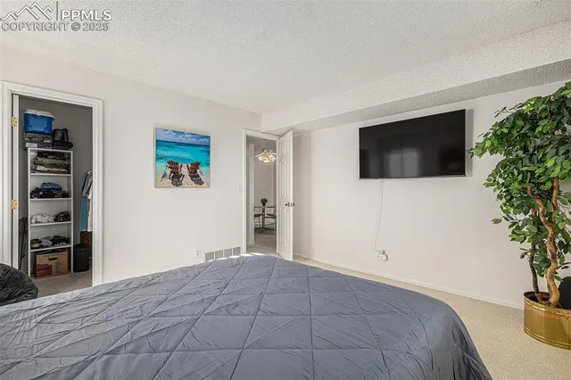 a view of a bedroom with a flat screen tv