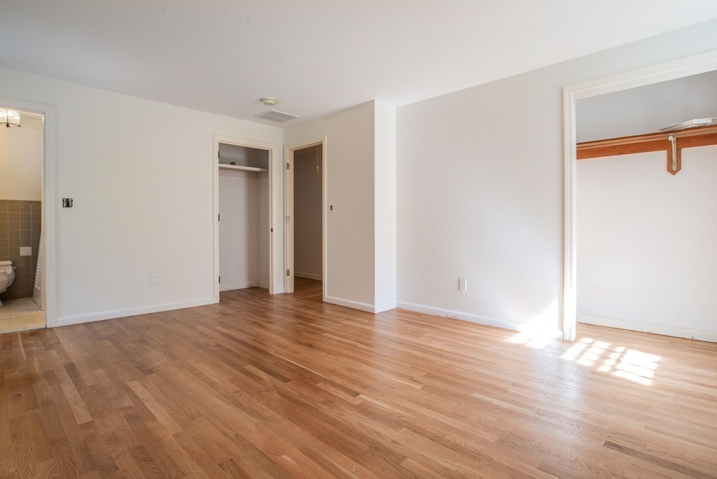 22 Ridge Hill Road Sudbury, MA 01776 - Photo 18 of 26 a view of an empty room with wooden floor and a window
