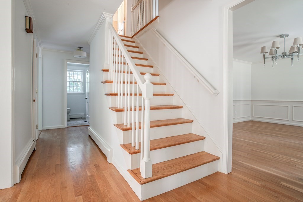 22 Ridge Hill Road Sudbury, MA 01776 - Photo 4 of 26 a view of entryway and hall with wooden floor
