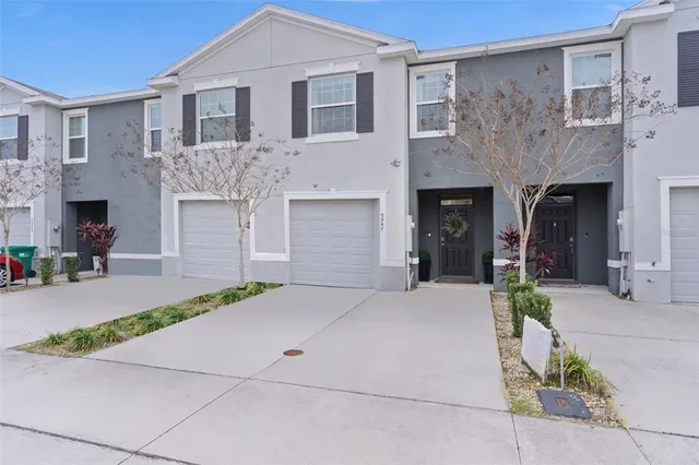 an aerial view of a house with a lake view