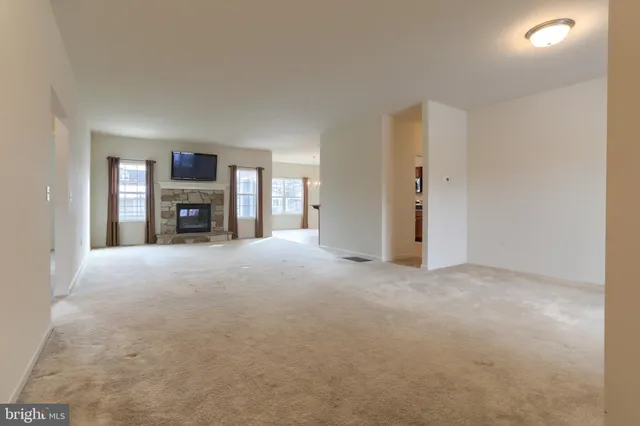 a view of a livingroom with furniture and a fireplace