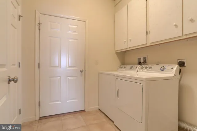 a large kitchen with stainless steel appliances granite countertop a sink and cabinets