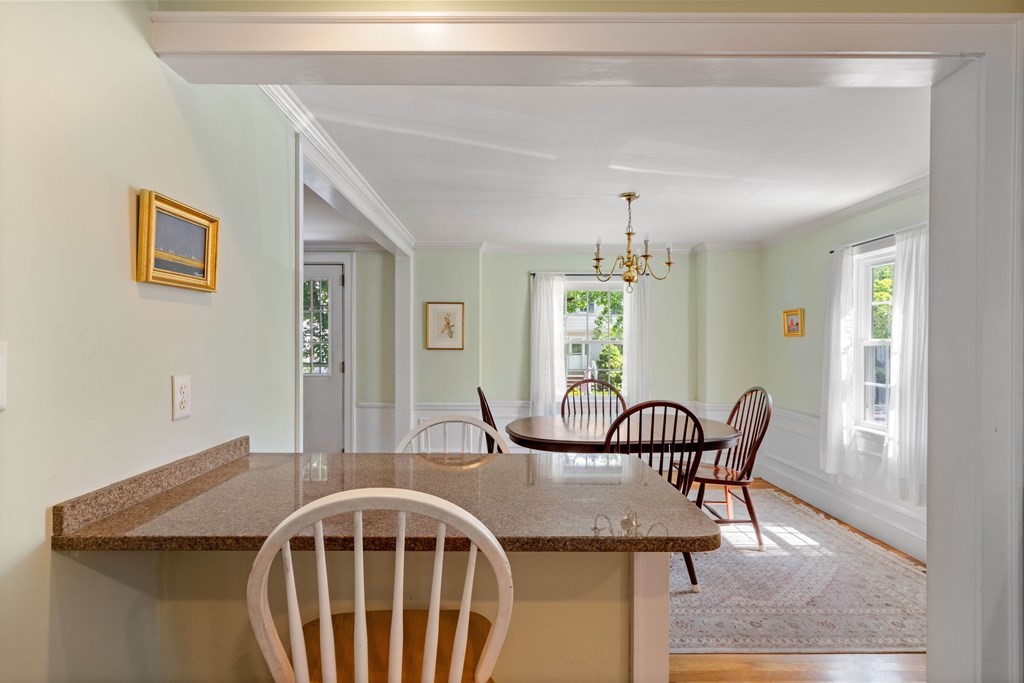 69 Statler Road Belmont, MA 02478 - Photo 13 of 34 a view of a dining room with furniture and a window