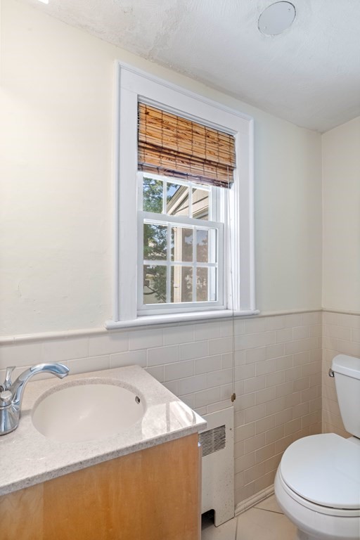 69 Statler Road Belmont, MA 02478 - Photo 16 of 34 a bathroom with a sink a toilet and a bathtub