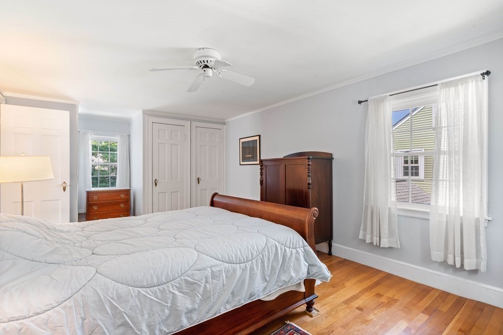 69 Statler Road Belmont, MA 02478 - Photo 18 of 34 a bedroom with a large bed and wooden floor