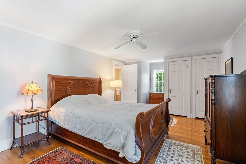 69 Statler Road Belmont, MA 02478 - Photo 19 of 34 a bedroom with a bed and wooden floor