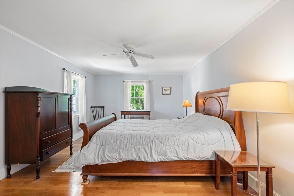 69 Statler Road Belmont, MA 02478 - Photo 20 of 34 a bedroom with a bed and wooden floor