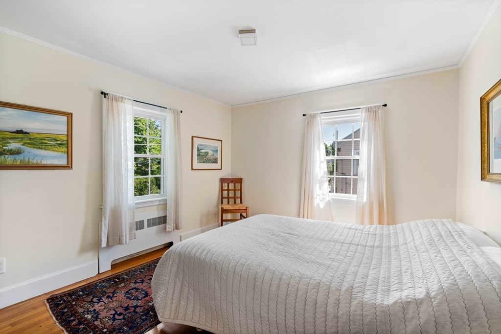 69 Statler Road Belmont, MA 02478 - Photo 21 of 34 a bedroom with a bed and a window