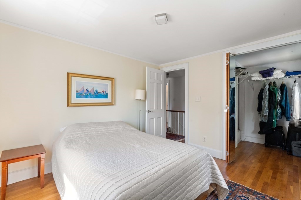 69 Statler Road Belmont, MA 02478 - Photo 23 of 34 a bedroom with a bed and a view of bathroom