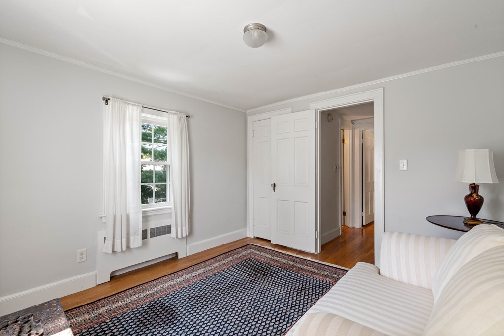 69 Statler Road Belmont, MA 02478 - Photo 25 of 34 a bedroom with a bed and a window