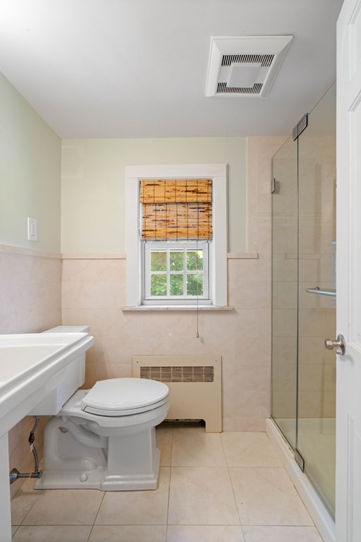 69 Statler Road Belmont, MA 02478 - Photo 27 of 34 a bathroom with a toilet sink and a shower