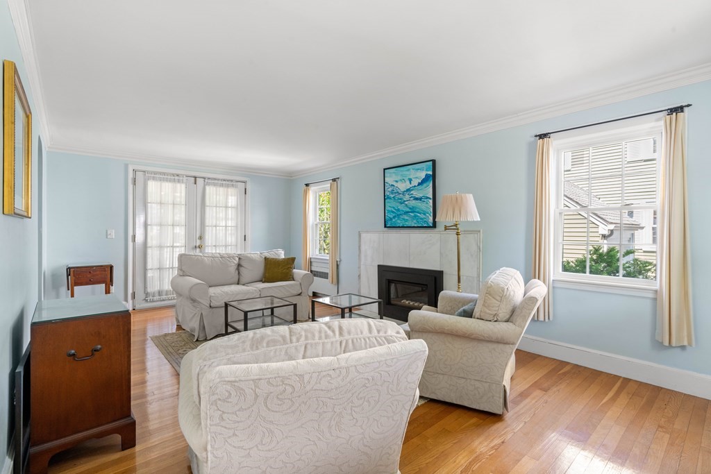 69 Statler Road Belmont, MA 02478 - Photo 4 of 34 a living room with furniture and a fireplace