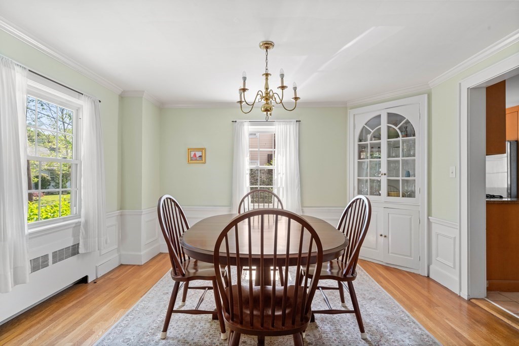 69 Statler Road Belmont, MA 02478 - Photo 8 of 34 a view of a dining room with furniture window and wooden floor