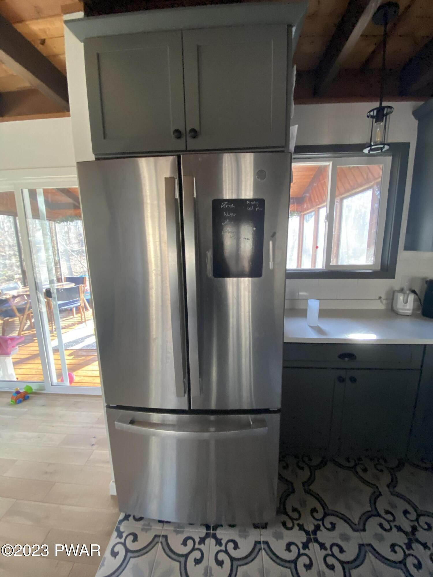 101 Maple Ridge Drive Hawley, PA 18428 - Photo 9 of 61 a metallic refrigerator freezer sitting in a kitchen