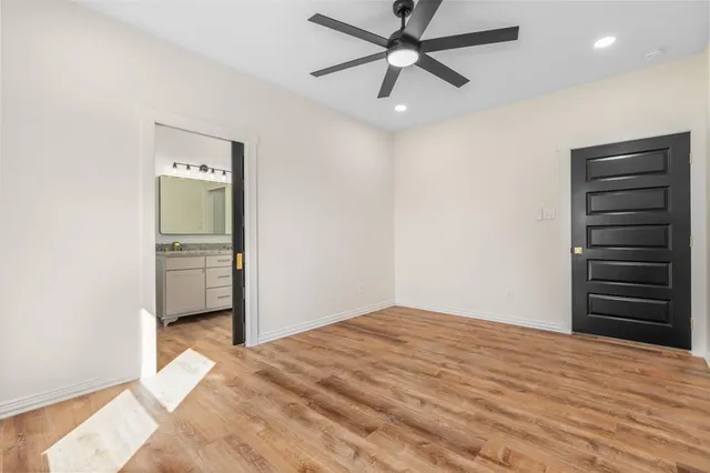 a bathroom with a granite countertop sink mirror and vanity