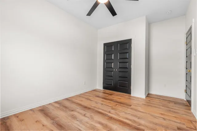 a bathroom with a toilet a sink a bathtub and a mirror