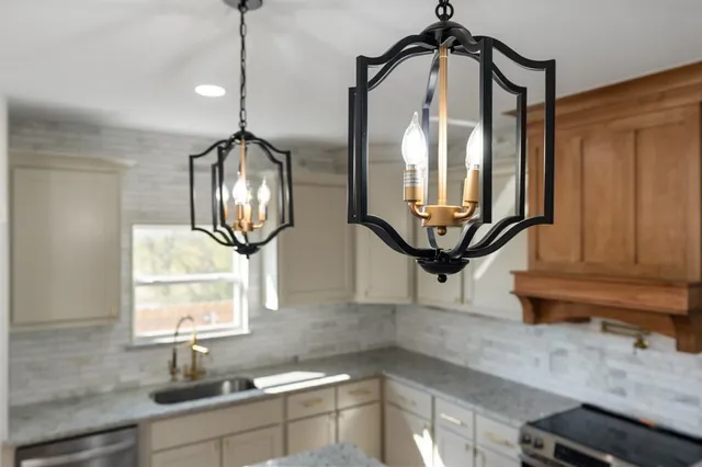 a bathroom with a sink a mirror and a window