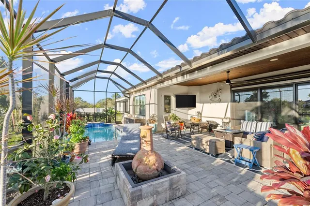 a bedroom with furniture and a flat screen tv