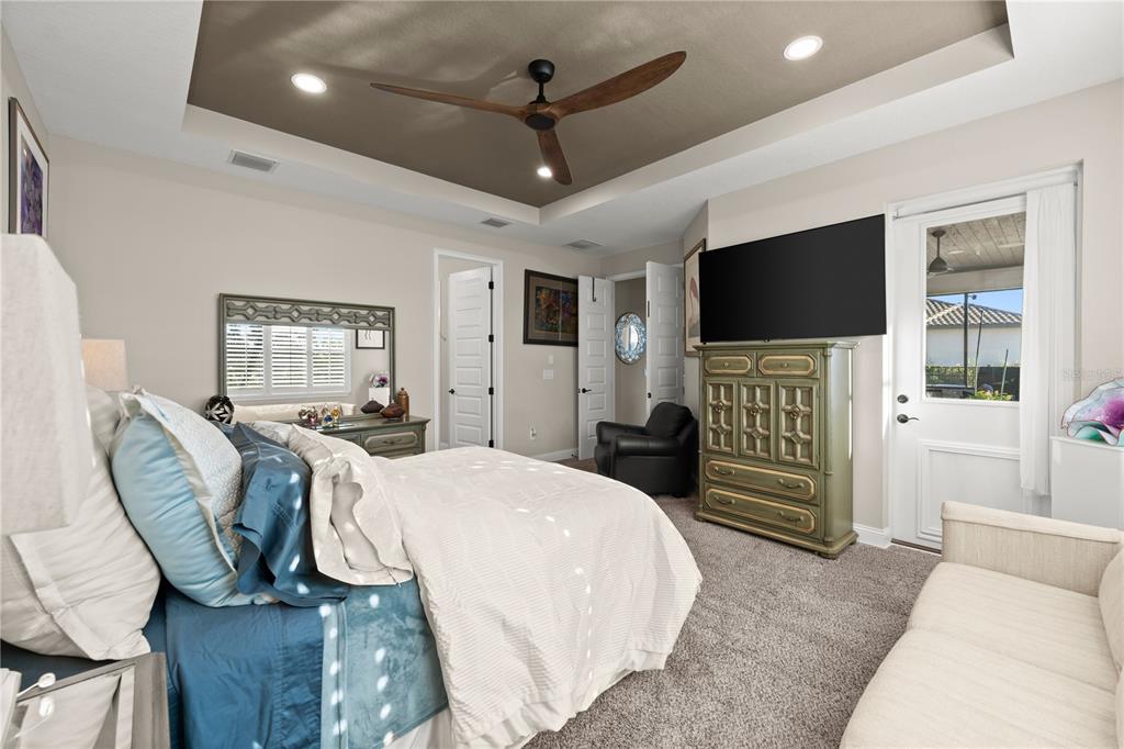 5 Rio Vista Drive Palm Coast, FL 32137 - Photo 29 of 74 a bedroom with furniture and a flat screen tv