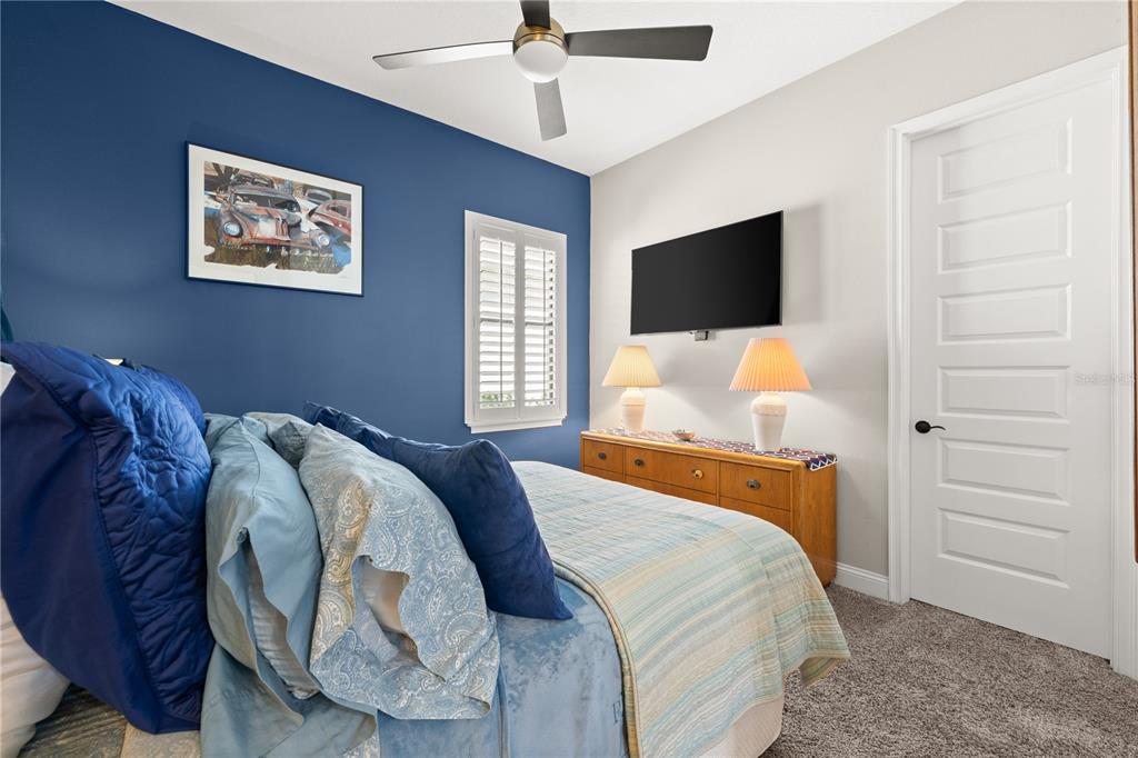 5 Rio Vista Drive Palm Coast, FL 32137 - Photo 34 of 74 a bedroom with a bed and a flat screen tv