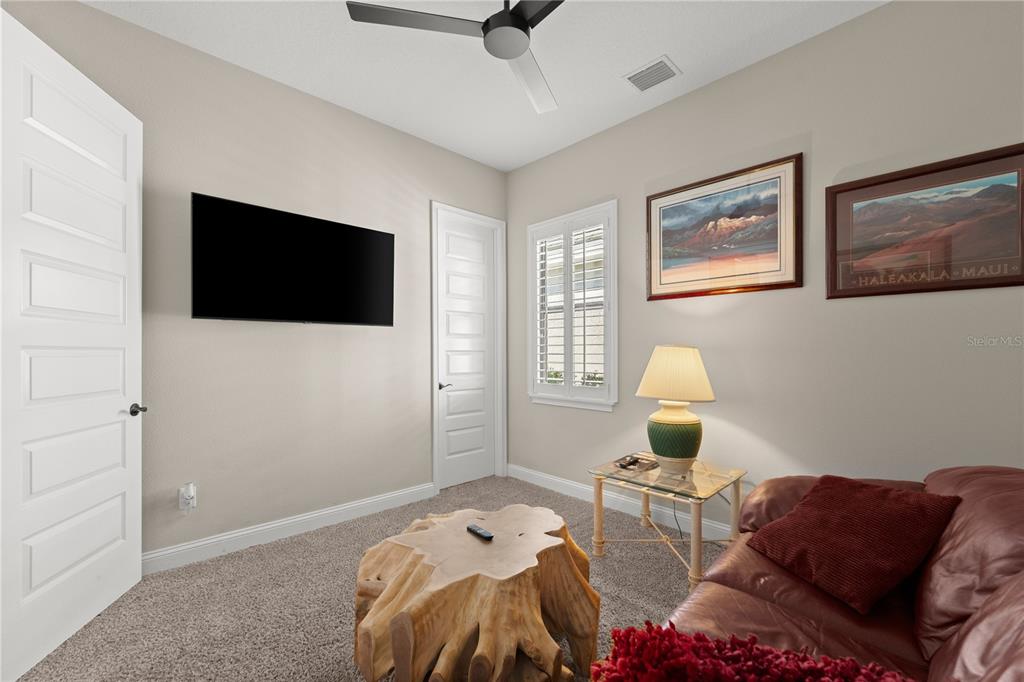 5 Rio Vista Drive Palm Coast, FL 32137 - Photo 35 of 74 a living room with furniture and a flat screen tv