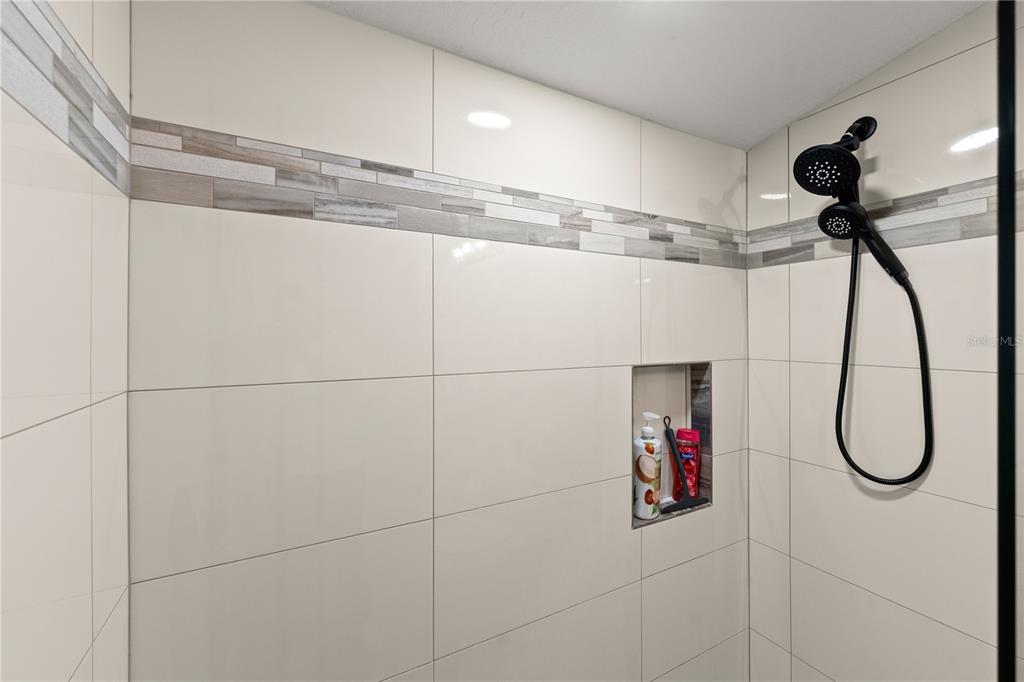 5 Rio Vista Drive Palm Coast, FL 32137 - Photo 48 of 74 a bathroom with a shower and a mirror