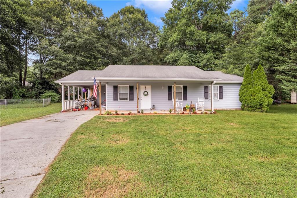 204 Reed Way Monroe, GA 30655 - Photo 1 of 1 a front view of a house with yard patio and green space