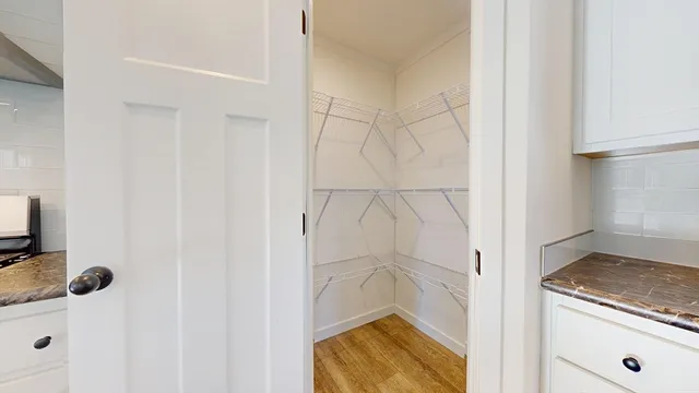 a bathroom with a granite countertop shower and a sink