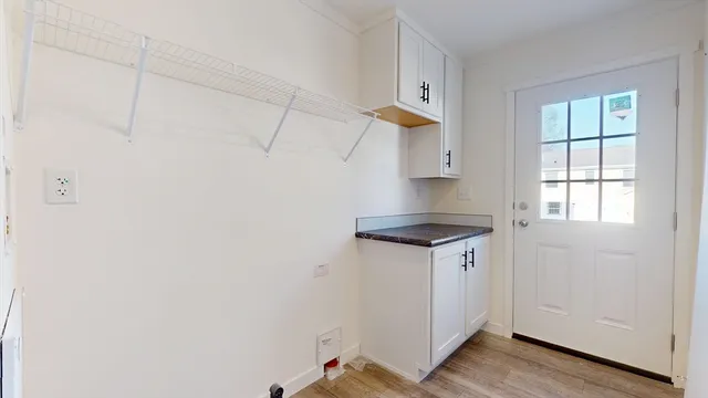 a view of a kitchen cabinets and wooden floor