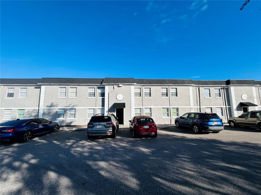 2791 L B McLeod Road, Unit D Orlando, FL 32805 - Photo 2 of 13 a car parked in front of a building