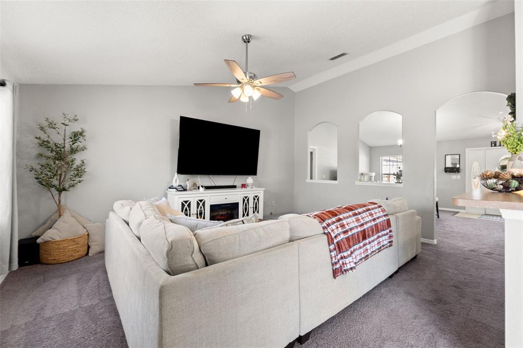 15335 Fleetwood Road Weeki Wachee, FL 34614 - Photo 18 of 40 a living room with furniture and a flat screen tv