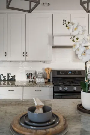 a kitchen with a stove and cabinets