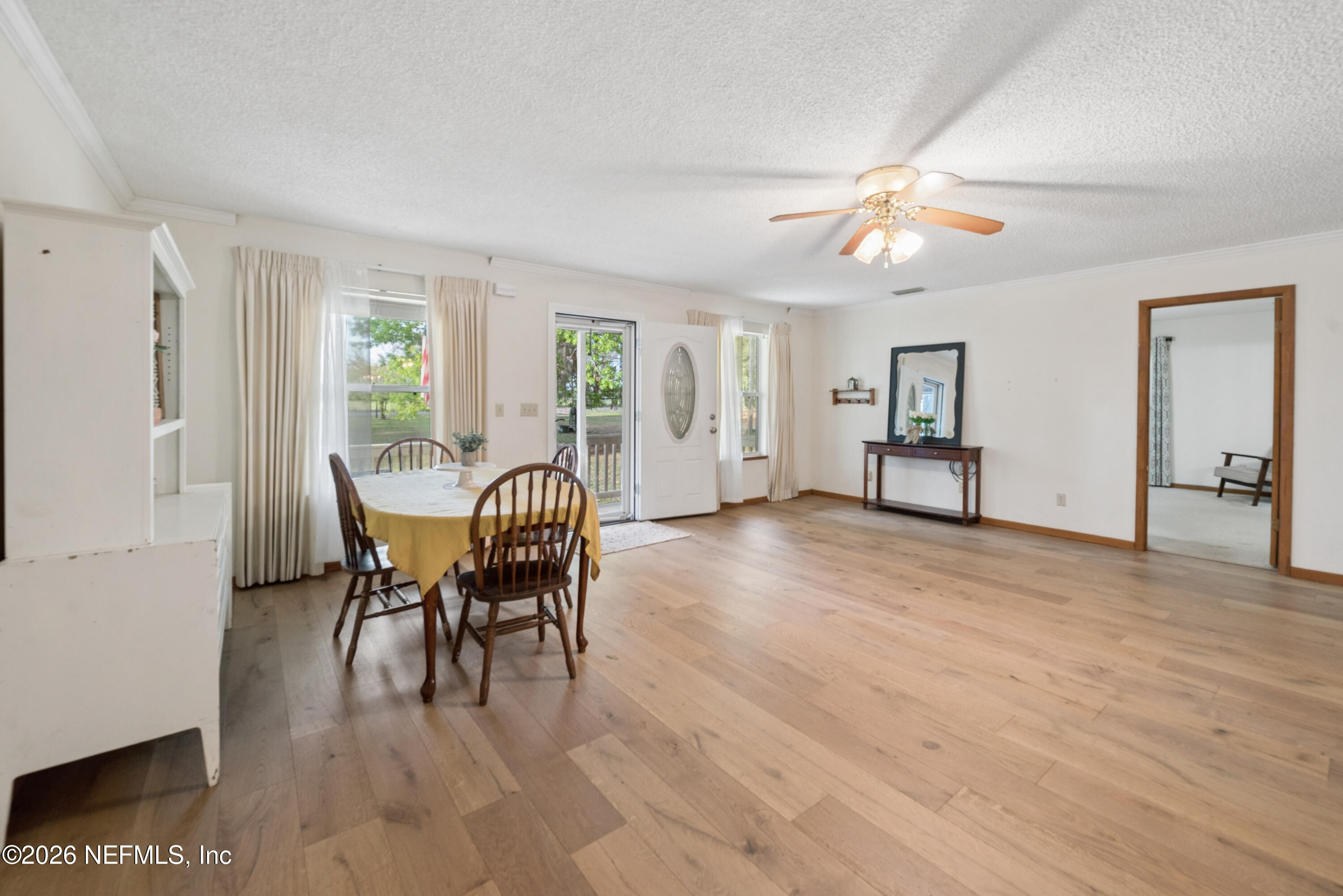 20021 Southeast 88th Trail Lake Butler, FL 32054 - Photo 19 of 43 a view of a livingroom with furniture window and wooden floor