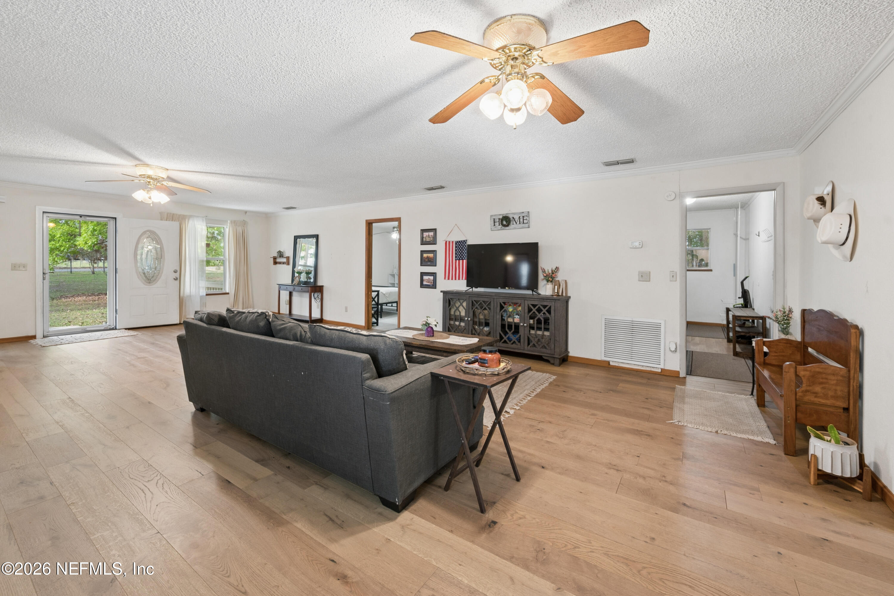 20021 Southeast 88th Trail Lake Butler, FL 32054 - Photo 21 of 43 a living room with furniture and a flat screen tv